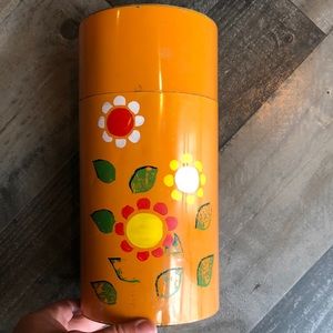 Vintage orange and floral metal coffee canister